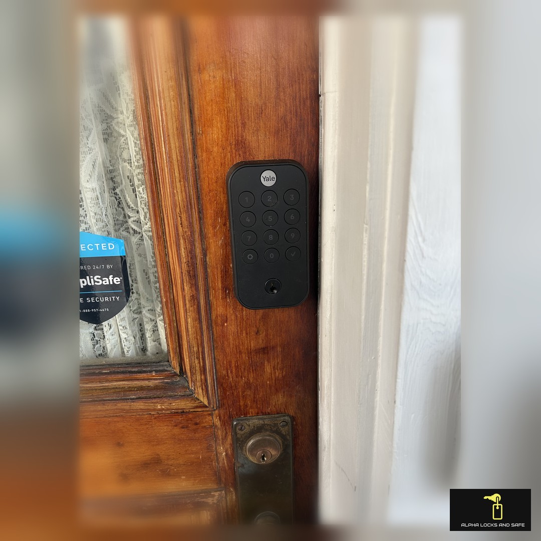 Modern smart lock installed on a wooden door